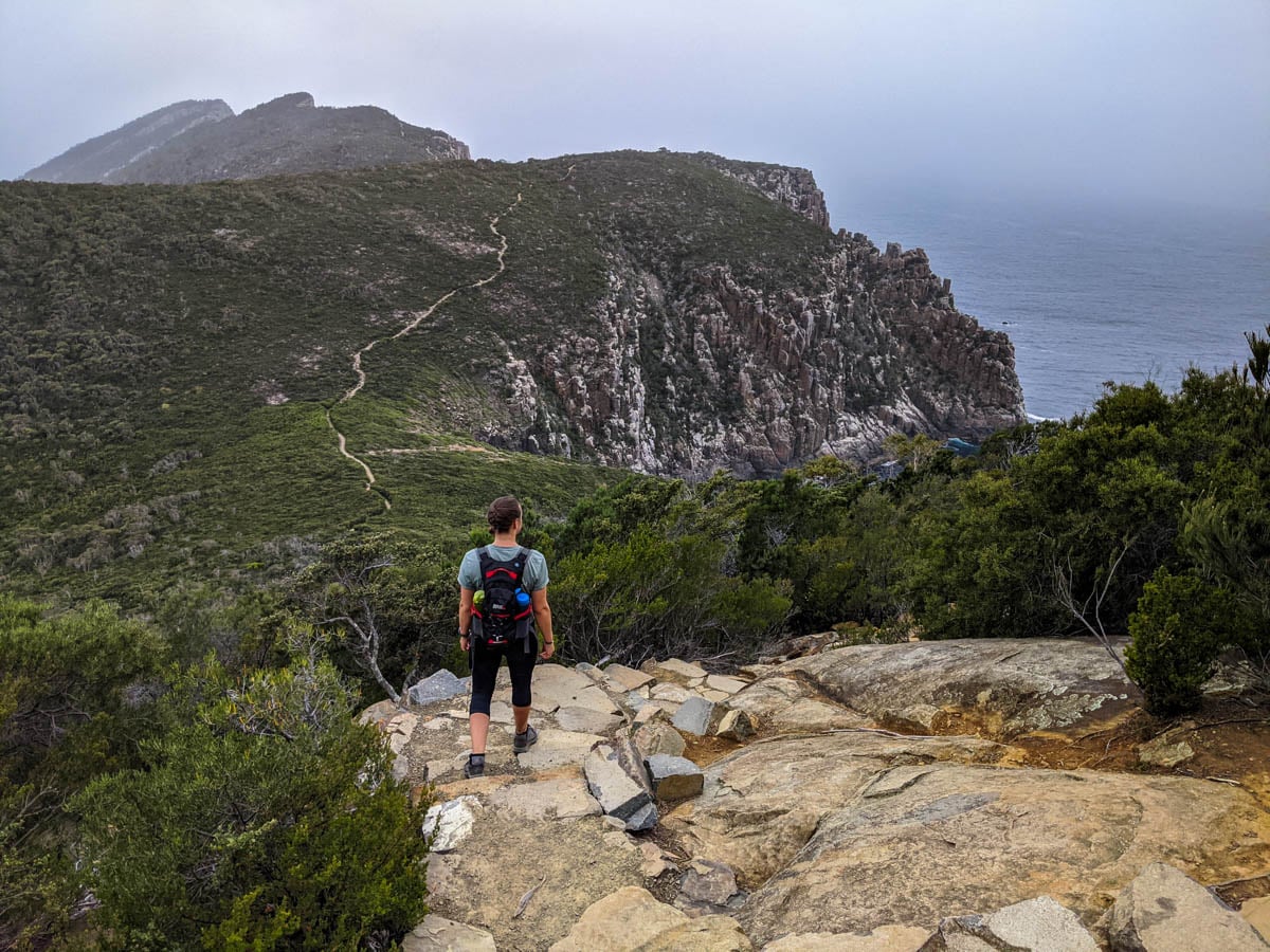 Walking in solitude on the Cape Huay Hike in Tasmania showing the peaceful nature of why you should hike