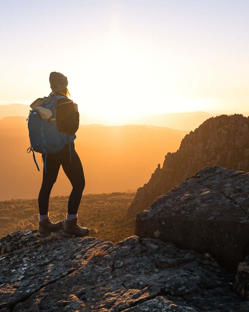 Watching the golden suset after climbing the Mt Victoria Hike in Tasmania