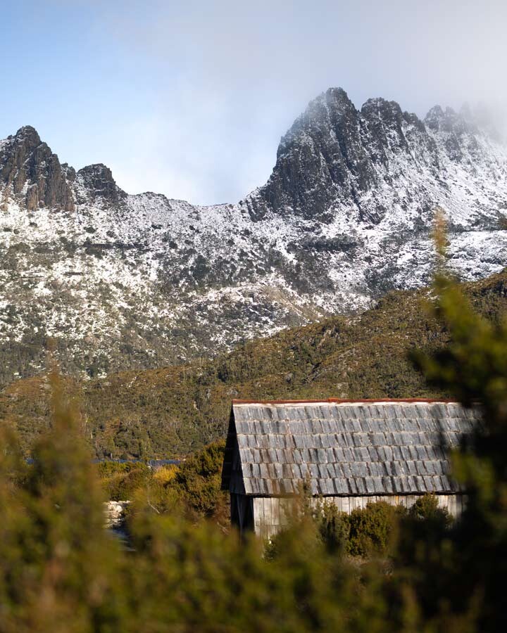 Cradle Mountain dwarfing the surrounding terrain and Dove Lake Boat Shed