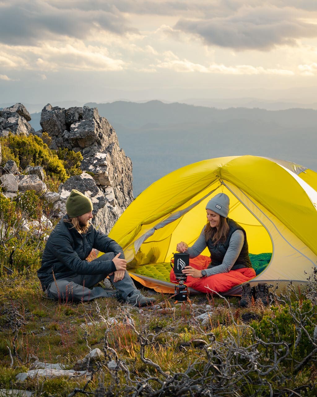 Cooking camp dinner with a Jetboil Sumo while staying comfortable on our hiking sleeping mats