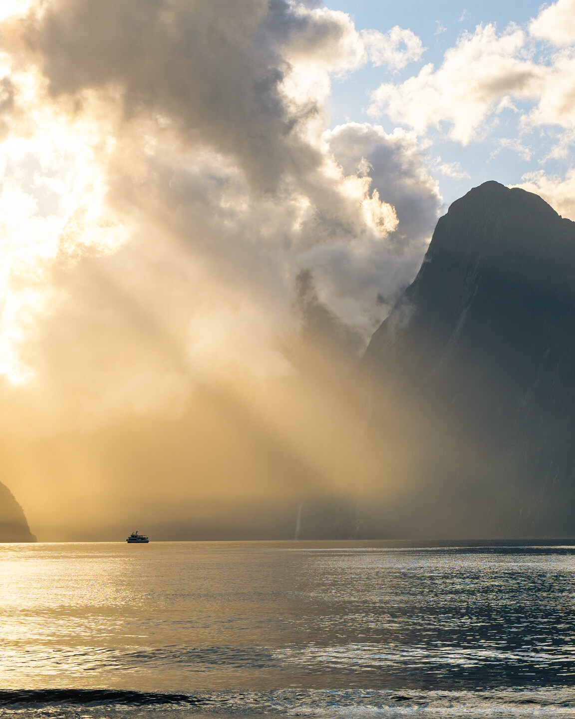 Incredible Sunset over Milford Sound with a Cruise Ship returning to the harbour