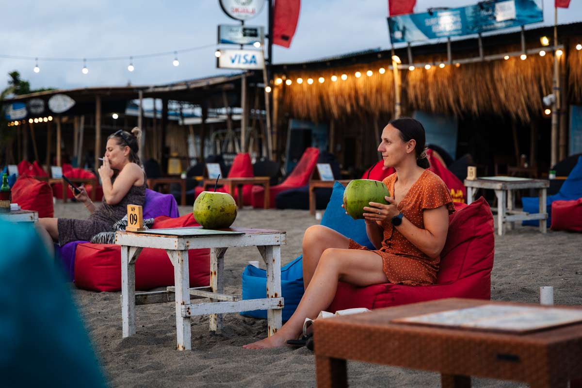 Sipping Coconuts at Warung Pojok on the beach in Canggu